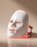GAIA HALO LED mask with red light mode active, warm studio backdrop